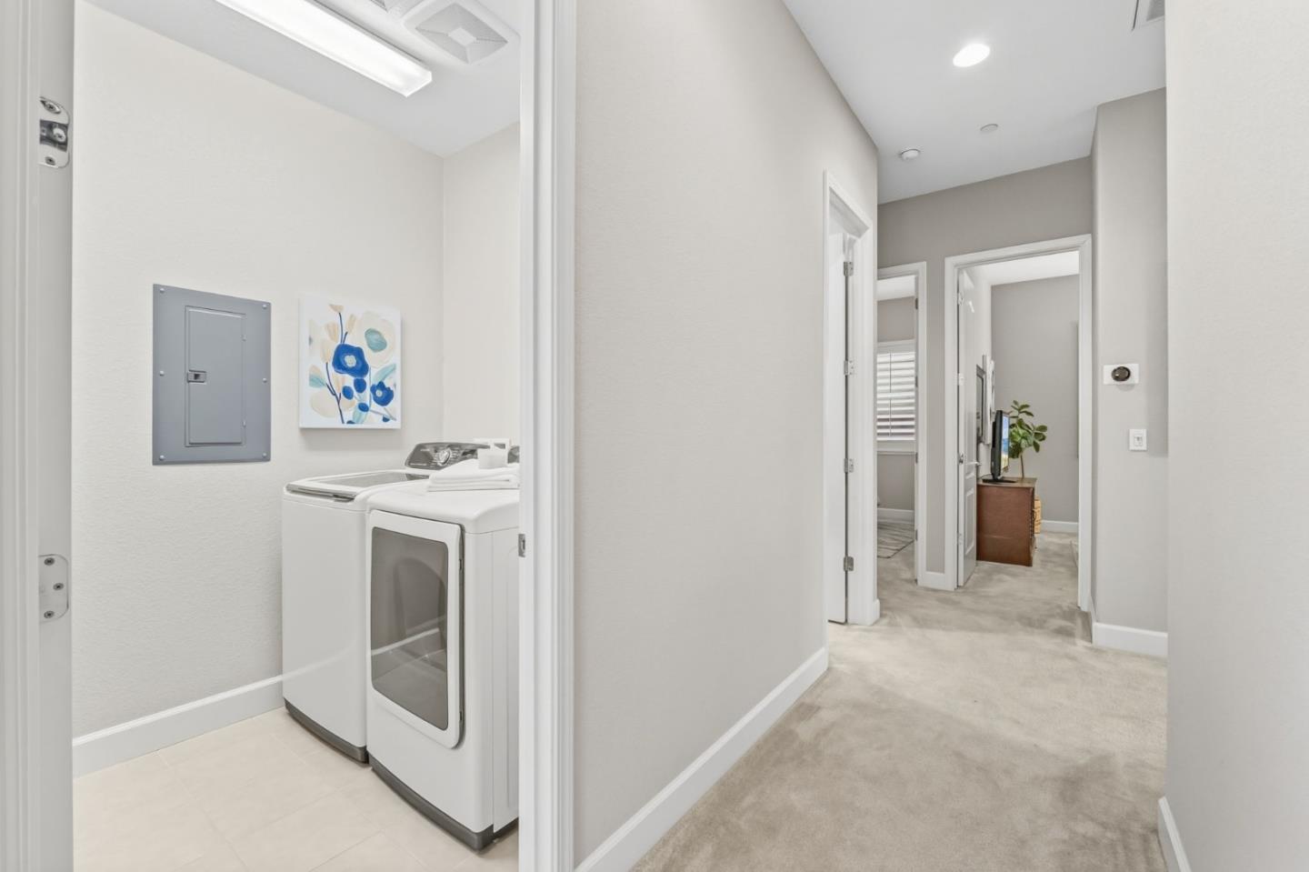 3716 Chiavari Way Manteca, CA 95337 - Photo 55 of 71 a view of a hallway with washer and dryer