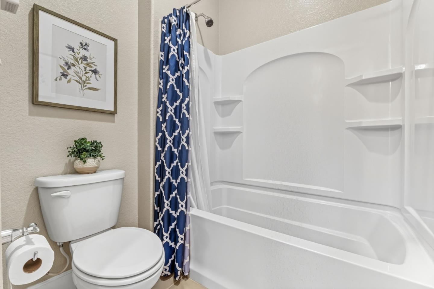 3716 Chiavari Way Manteca, CA 95337 - Photo 59 of 71 a bathroom with a toilet and a bathtub with shower