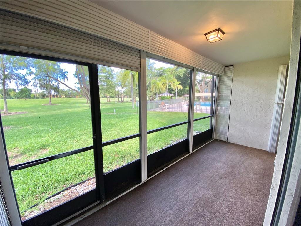 7650 West McNab Road, Unit 108 Tamarac, FL 33321 - Photo 14 of 18 a view of a room with window