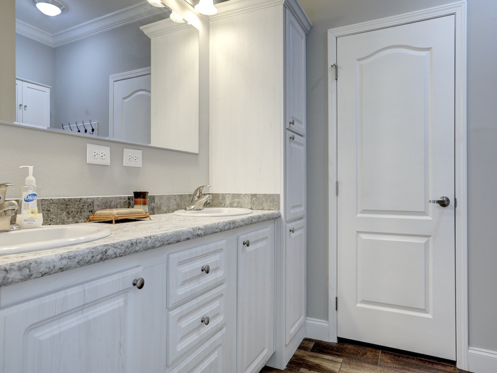 1011 Barefoot Circle Barefoot Bay, FL 32976 - Photo 14 of 31 a kitchen with granite countertop white cabinets and a sink