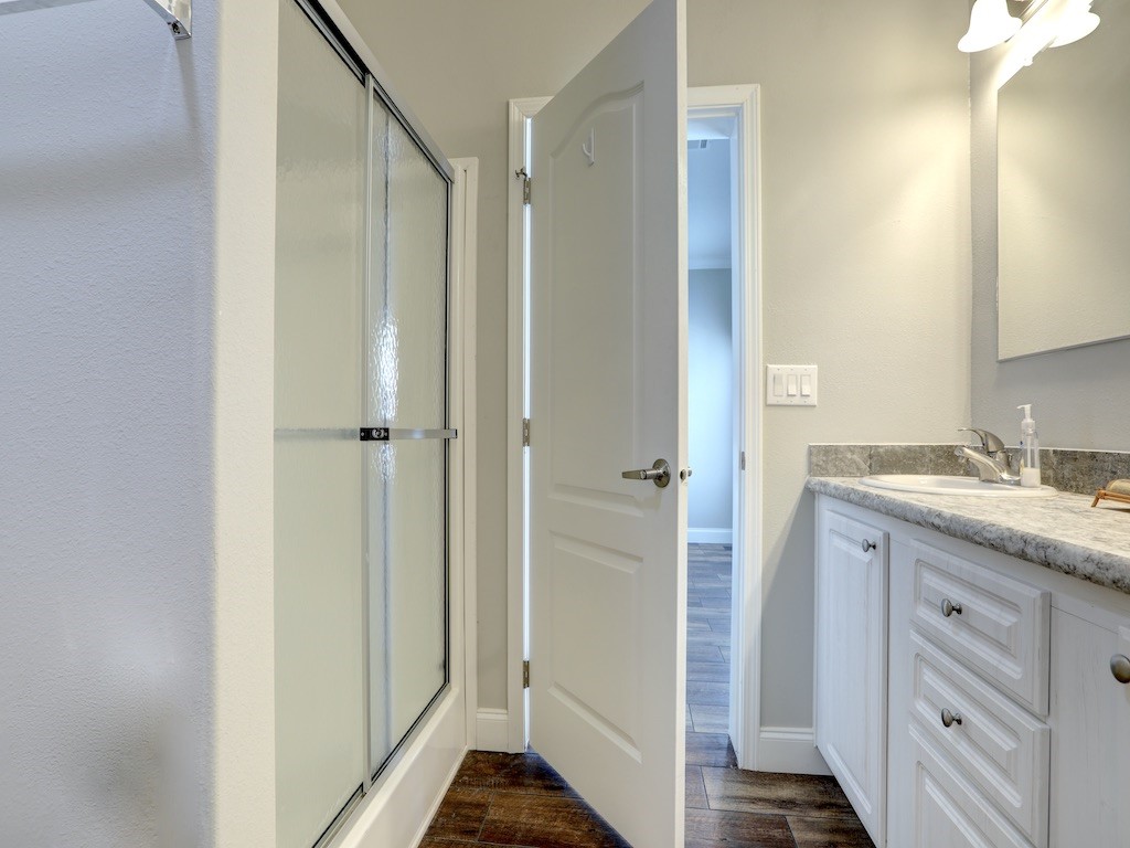1011 Barefoot Circle Barefoot Bay, FL 32976 - Photo 15 of 31 a bathroom with a granite countertop sink and a mirror