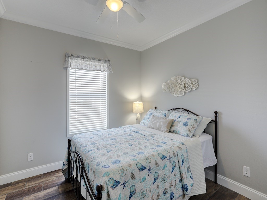 1011 Barefoot Circle Barefoot Bay, FL 32976 - Photo 19 of 31 a bedroom with a bed and a window