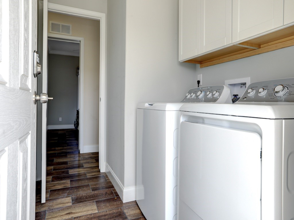 1011 Barefoot Circle Barefoot Bay, FL 32976 - Photo 21 of 31 a view of a hallway with washer and dryer
