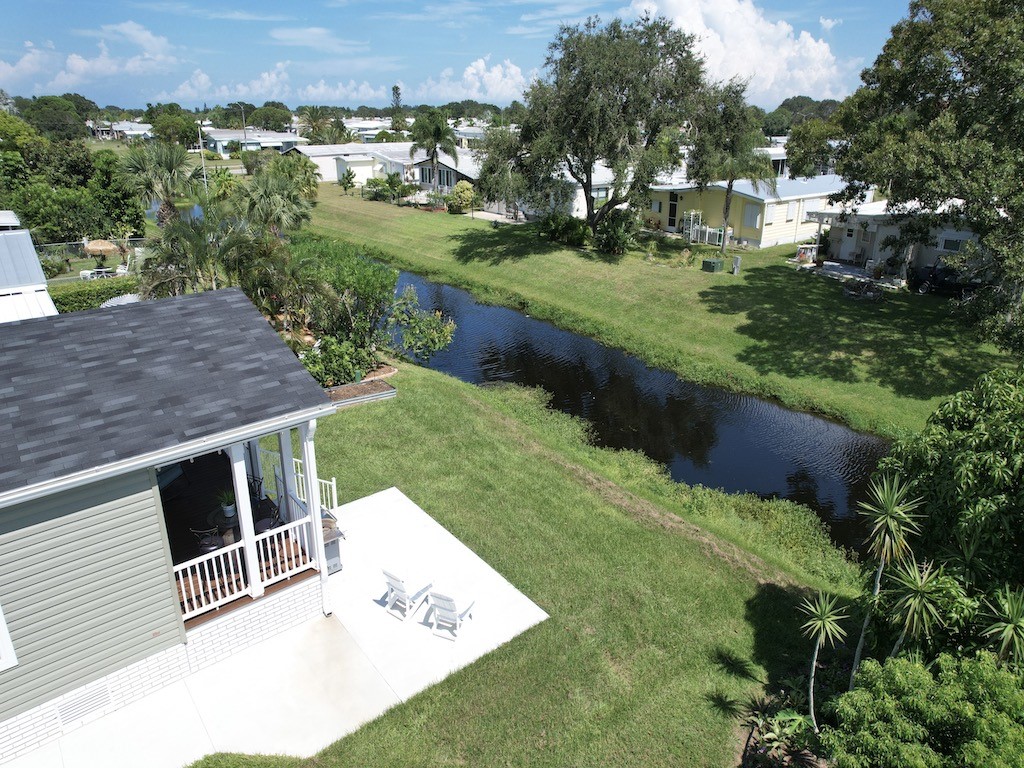 1011 Barefoot Circle Barefoot Bay, FL 32976 - Photo 25 of 31 an aerial view of a house with a yard