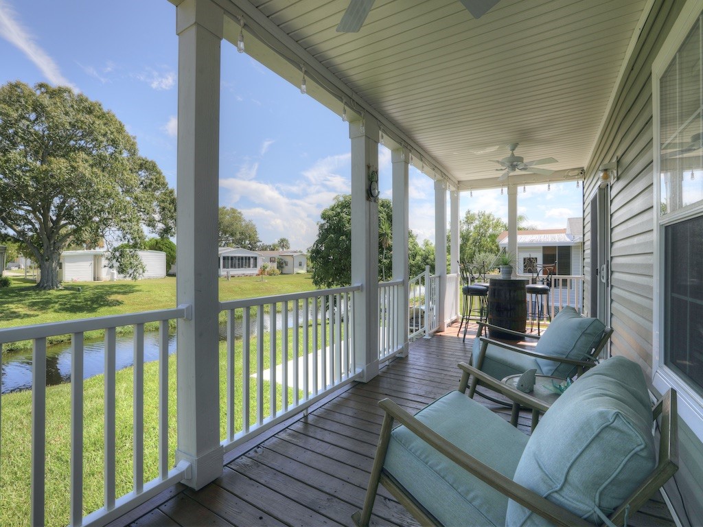 1011 Barefoot Circle Barefoot Bay, FL 32976 - Photo 5 of 31 a view of a porch with furniture