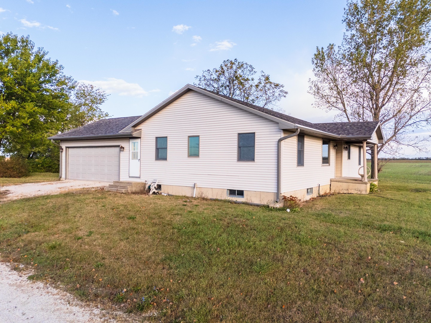 23601 North 1700 E Road Odell, IL 60460 - Photo 16 of 49 a big house with a yard and large trees