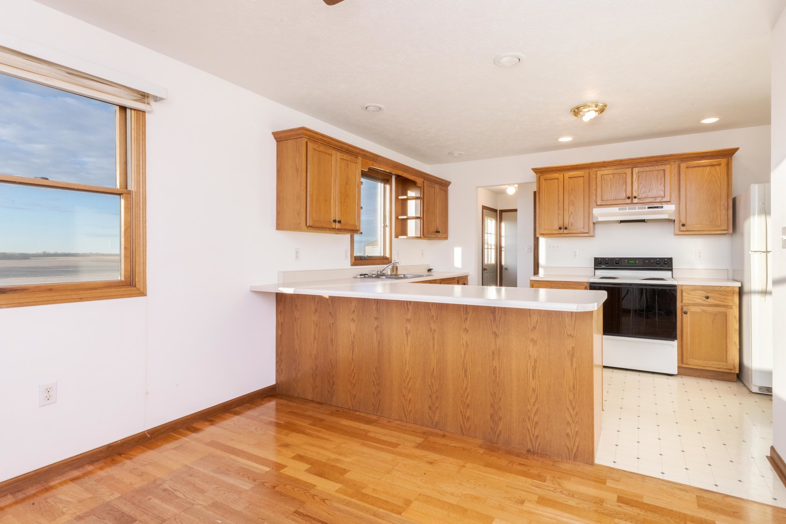 23601 North 1700 E Road Odell, IL 60460 - Photo 31 of 49 a kitchen with stainless steel appliances granite countertop a stove a sink and a refrigerator