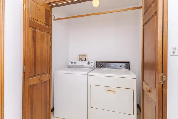 an empty room with a ceiling fan and a window