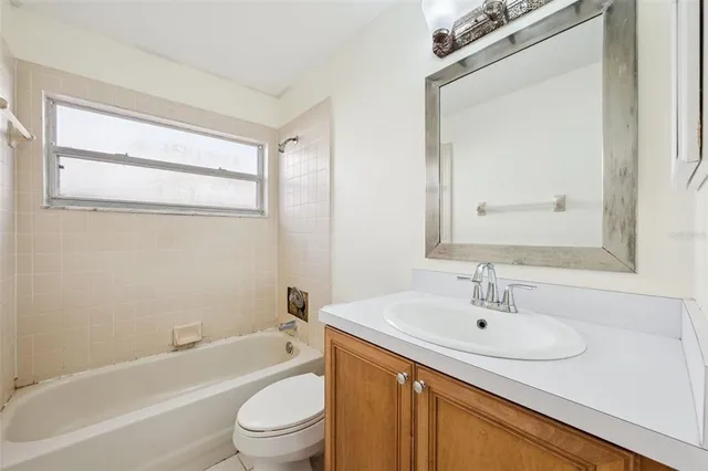 a bathroom with a sink a toilet and a bathtub