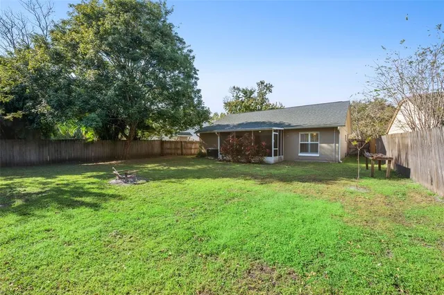 a front view of a house with yard and green space