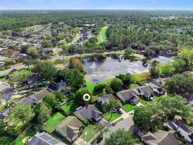 an aerial view of residential house with outdoor space and river view