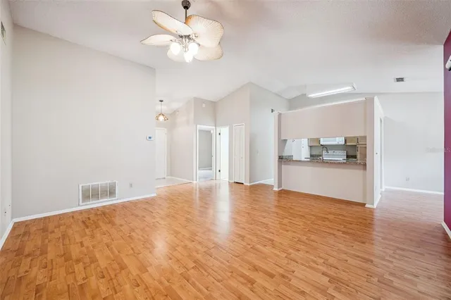 a view of kitchen cabinet and wooden floor