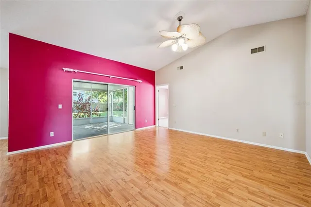 a view of an empty room with a window