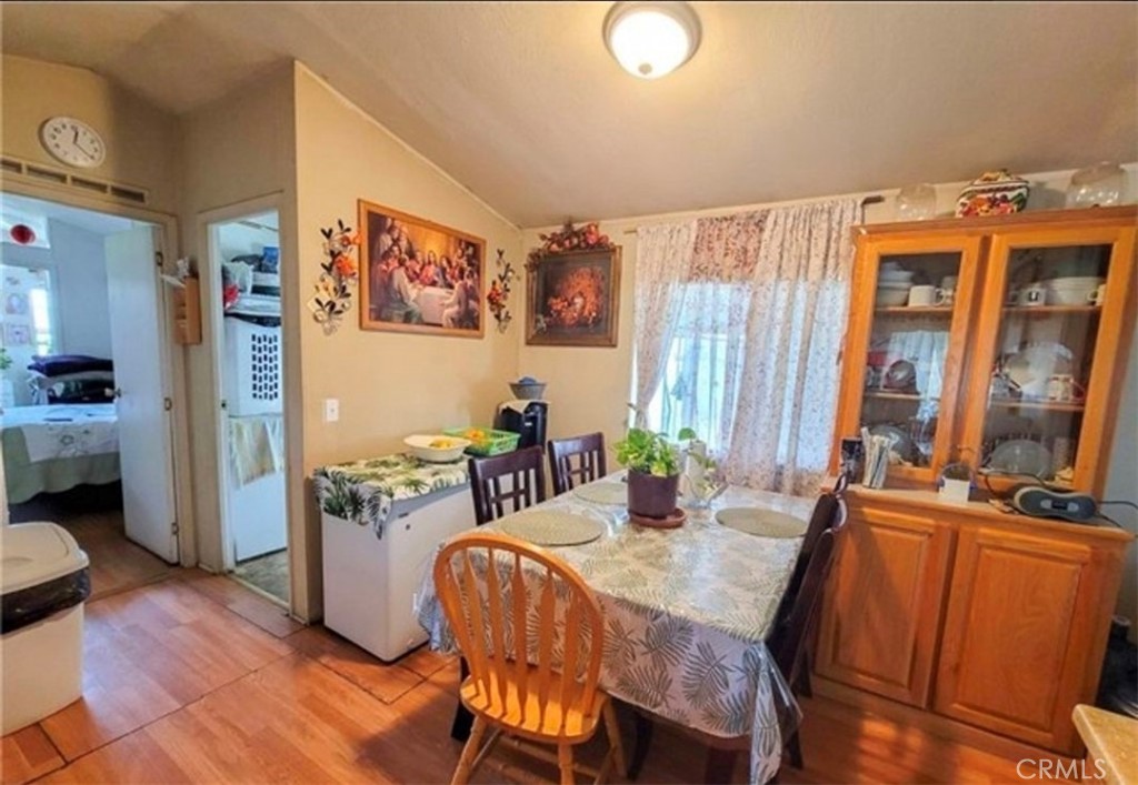 2500 North State Highway 59, Unit 278 Merced, CA 95348 - Photo 13 of 25 a view of a dining room with furniture window and wooden floor