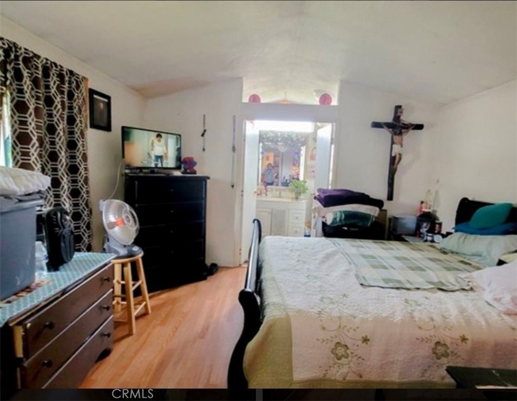 2500 North State Highway 59, Unit 278 Merced, CA 95348 - Photo 17 of 25 a bedroom with a bed and dresser