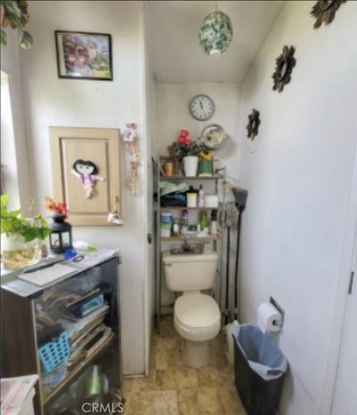 2500 North State Highway 59, Unit 278 Merced, CA 95348 - Photo 19 of 25 a bathroom with a toilet sink and mirror