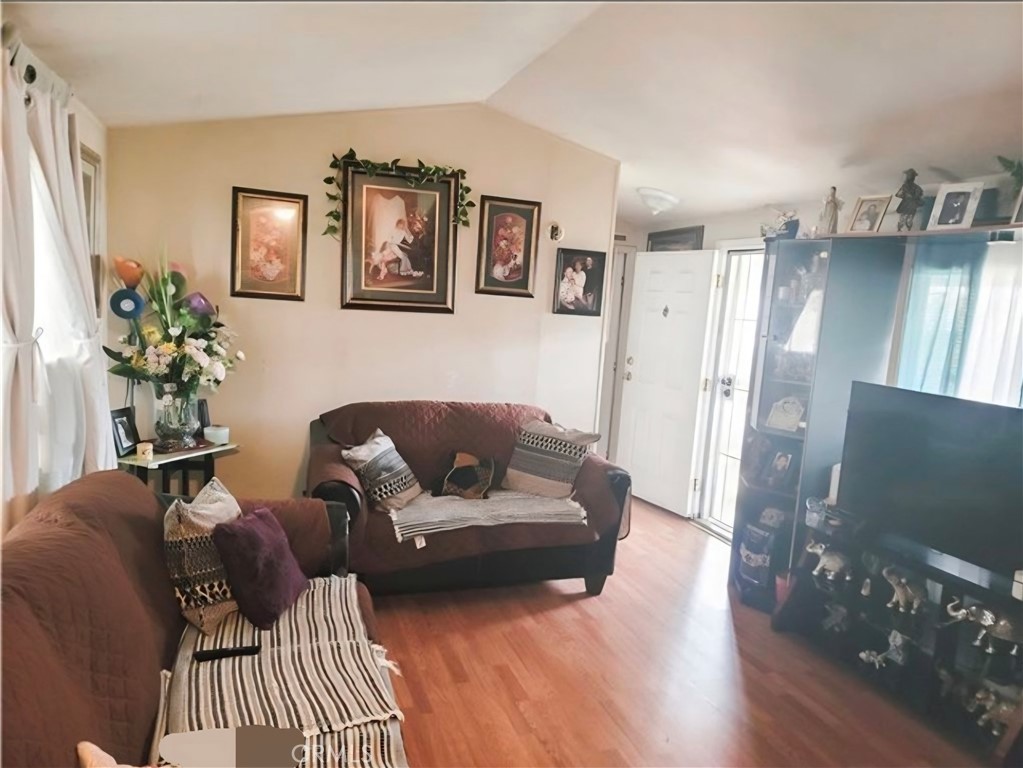2500 North State Highway 59, Unit 278 Merced, CA 95348 - Photo 5 of 25 a living room with furniture and a flat screen tv