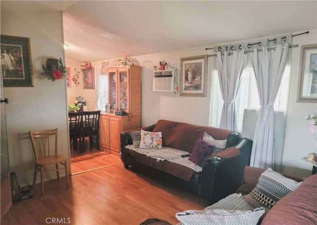 2500 North State Highway 59, Unit 278 Merced, CA 95348 - Photo 6 of 25 a living room with furniture and a wooden floor