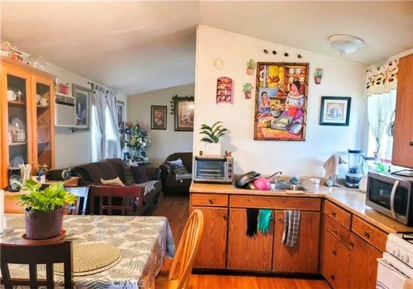a living room with furniture and flowers
