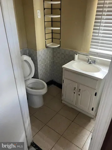 a bathroom with a sink and toilet