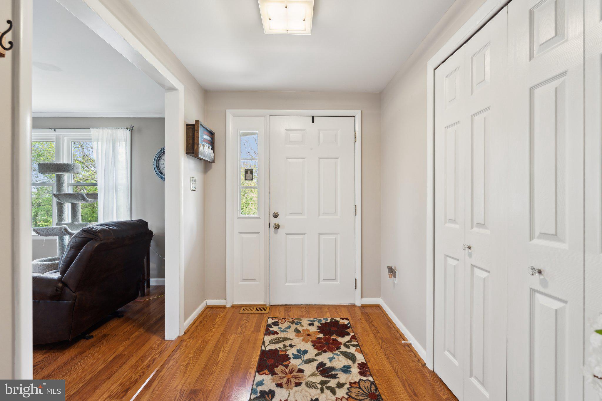 220 Lamphier Street Culpeper, VA 22701 - Photo 16 of 51 a view of a bedroom with wooden floor and closet