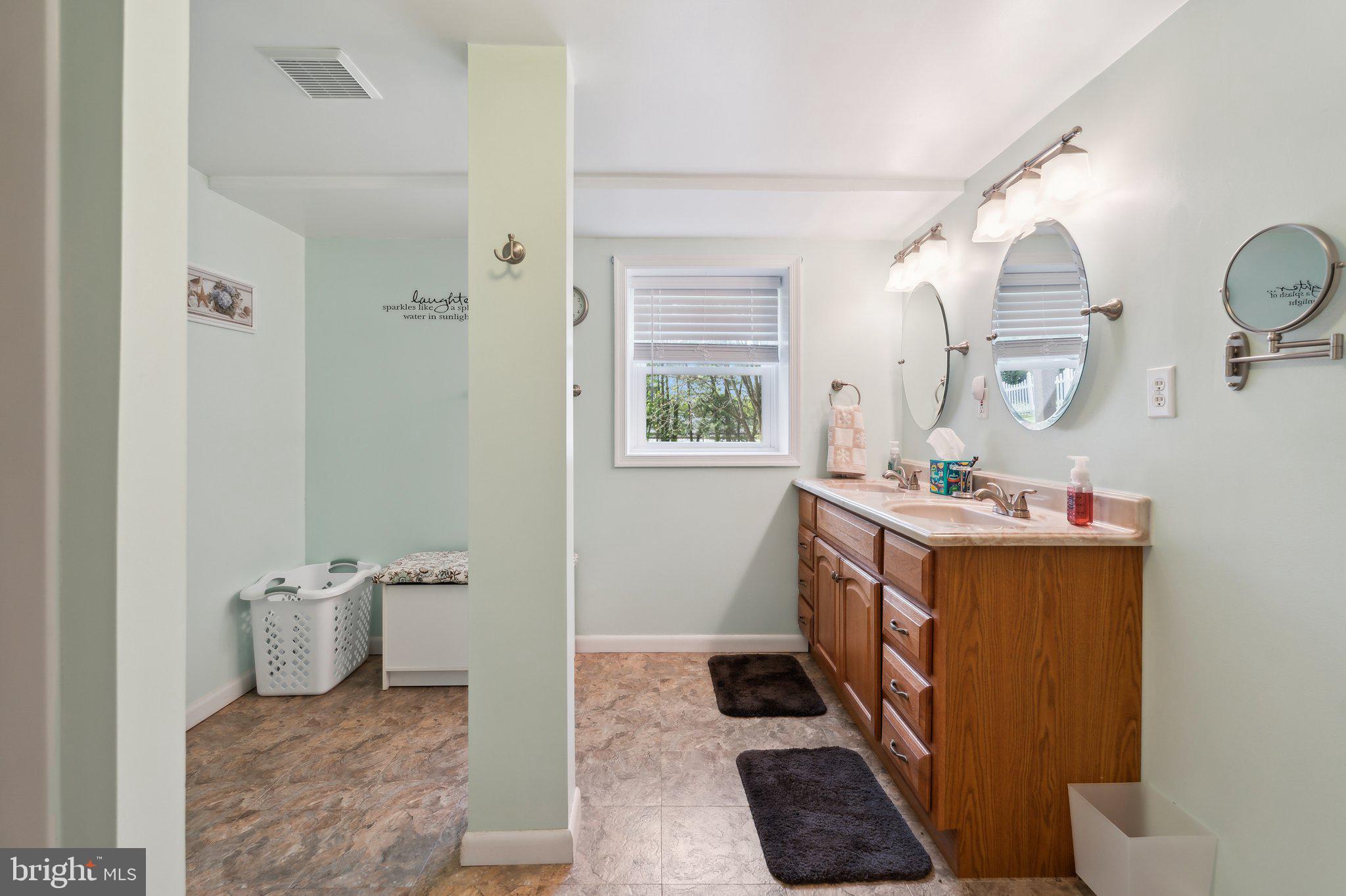 220 Lamphier Street Culpeper, VA 22701 - Photo 35 of 51 a bathroom with double vanity and a mirror