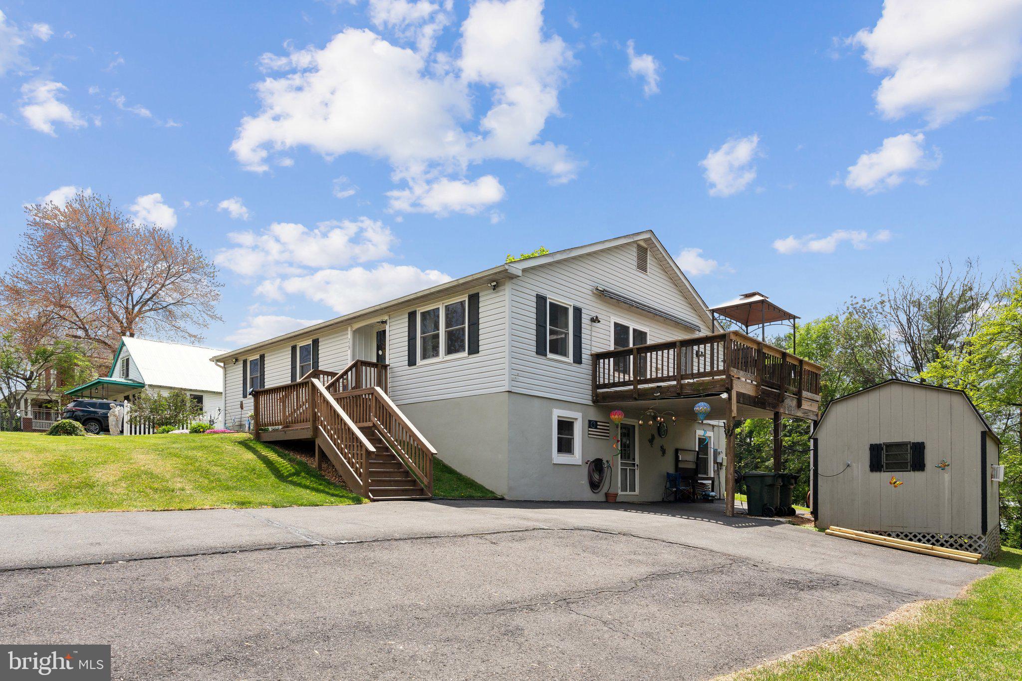 220 Lamphier Street Culpeper, VA 22701 - Photo 46 of 51 a front view of a house with a yard and garage