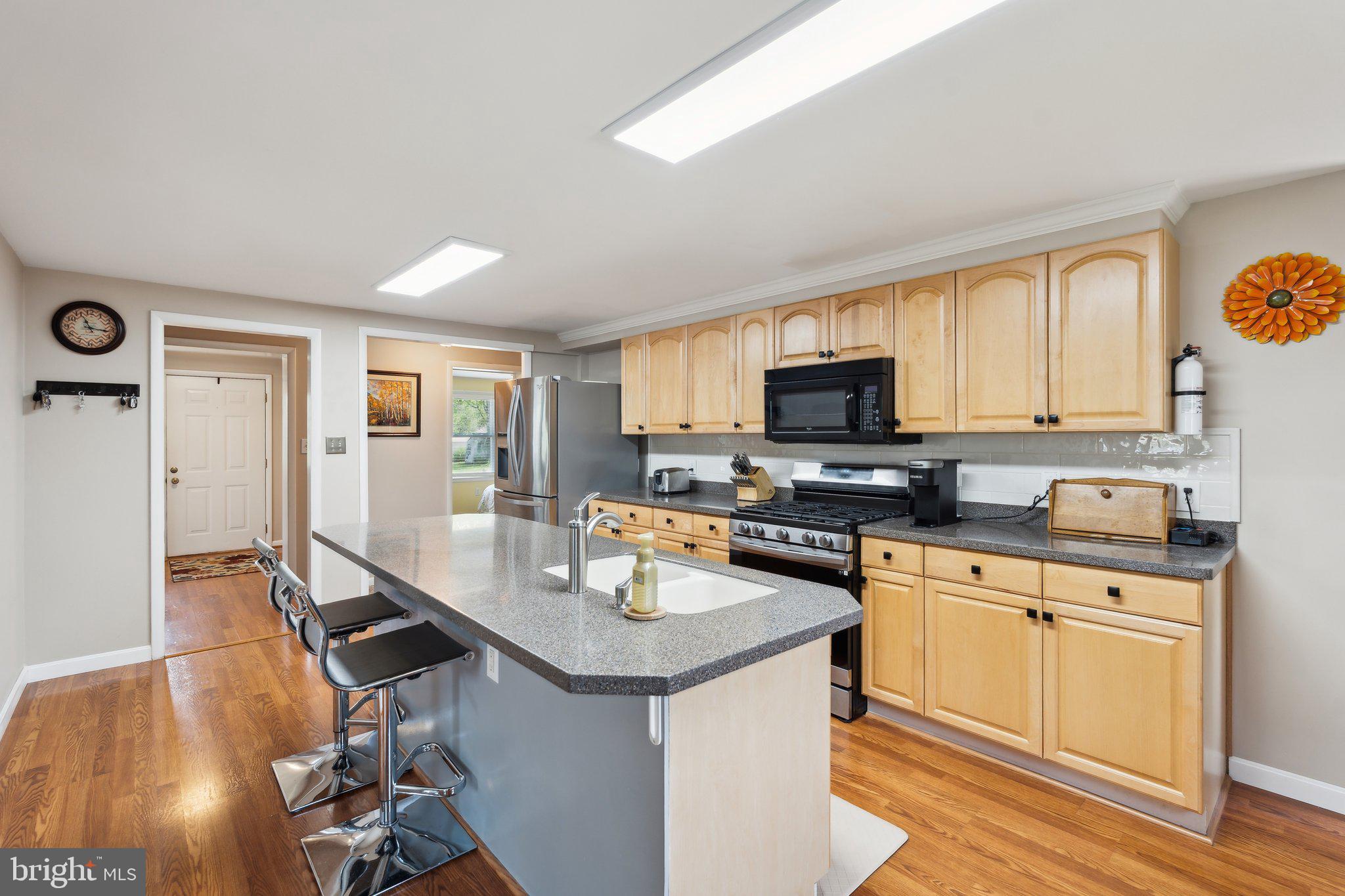 220 Lamphier Street Culpeper, VA 22701 - Photo 5 of 51 a kitchen with a sink appliances and cabinets