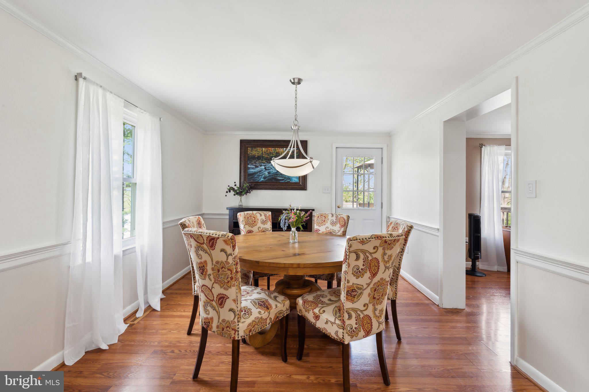 220 Lamphier Street Culpeper, VA 22701 - Photo 10 of 51 a view of a dining room with furniture window and wooden floor