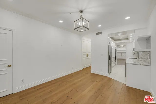 wooden floor in an empty room with a glass door