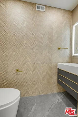 a bathroom with a shower and a toilet