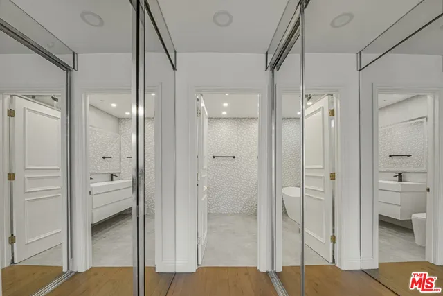 a bathroom with a glass door shower
