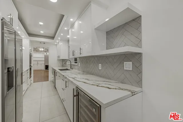 a kitchen with a sink stove and refrigerator