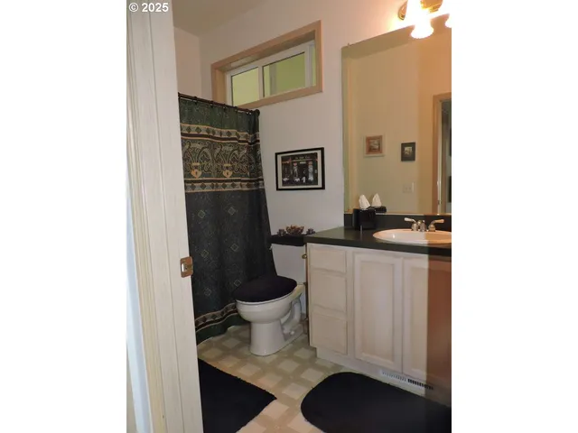 a room with a sink and a mirror