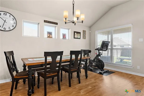 a view of a dining room with furniture window and outside view