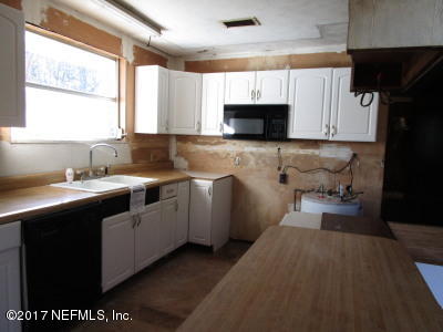 54207 Hurst Road Callahan, FL 32011 - Photo 4 of 12 a kitchen with a sink cabinets and window