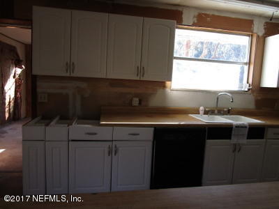 54207 Hurst Road Callahan, FL 32011 - Photo 5 of 12 a kitchen with a sink and cabinets