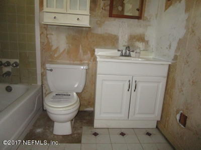 54207 Hurst Road Callahan, FL 32011 - Photo 8 of 12 a bathroom with a sink toilet and shower