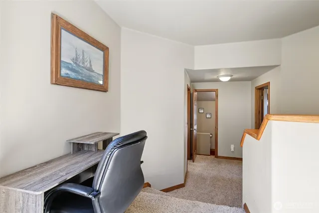 a bedroom with a bed and large window