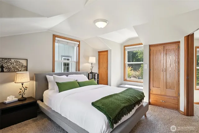 a bathroom with a toilet a sink and a window