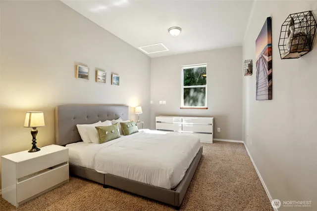 a bedroom with furniture and a book shelf