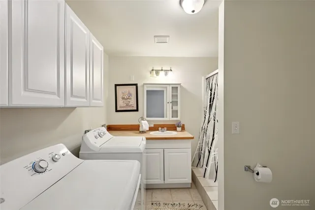 a view of a patio with table and chairs and potted plants