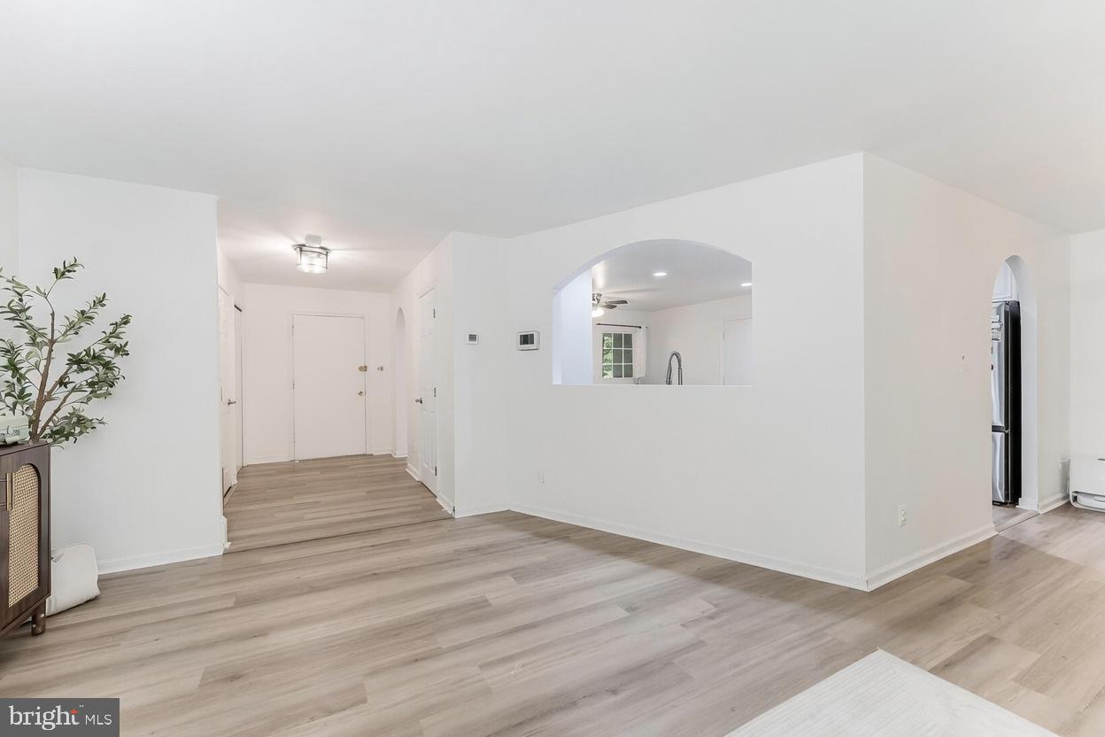 11621 Sourwood Lane Reston, VA 20191 - Photo 17 of 26 a view of empty room with wooden floor