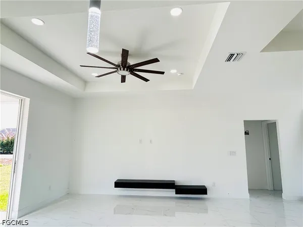 a view of room with a ceiling fan
