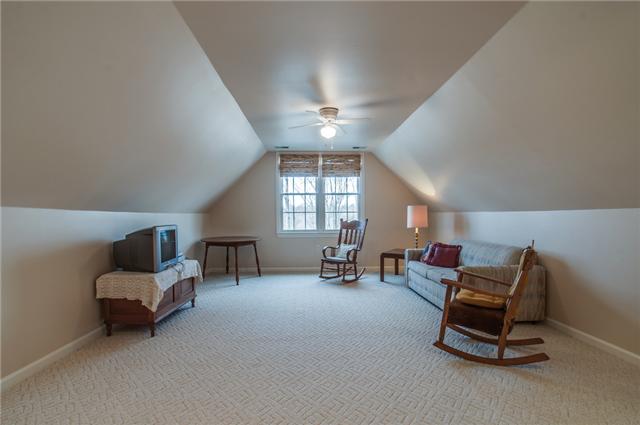 8694 Haselton Road Nashville, TN 37221 - Photo 13 of 19 Upstairs den area with vaulted ceiling, ceiling fan and carpet.