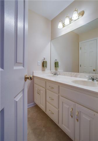 8694 Haselton Road Nashville, TN 37221 - Photo 15 of 19 Full hall bath with double sinks and tub/shower combination.