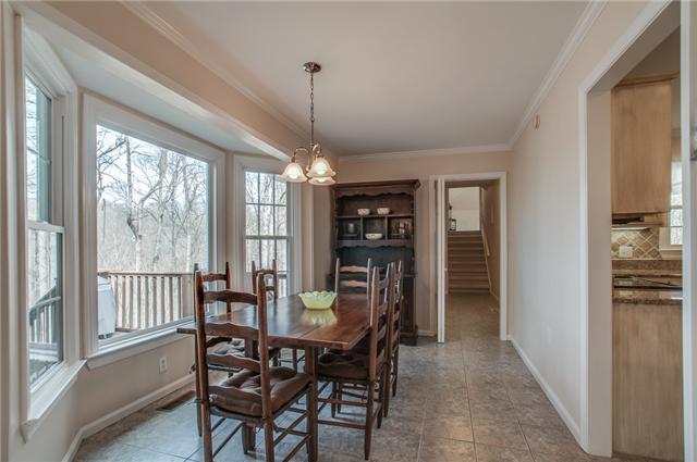8694 Haselton Road Nashville, TN 37221 - Photo 8 of 19 Breakfast room with bay window, chandelier and tile floors.