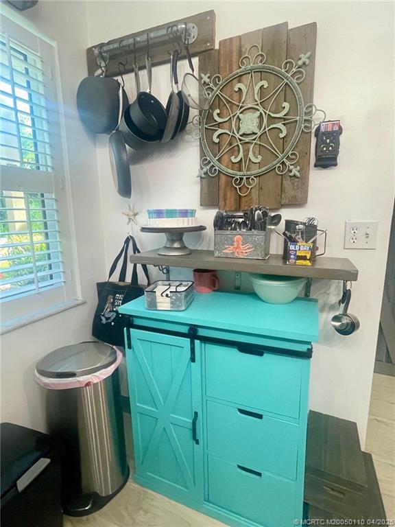 3121 Southeast Aster Lane, Unit 1601 Stuart, FL 34994 - Photo 11 of 58 a kitchen with a sink and a stove