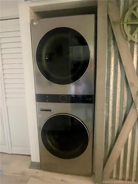 3121 Southeast Aster Lane, Unit 1601 Stuart, FL 34994 - Photo 16 of 58 a utility room with dryer and washer