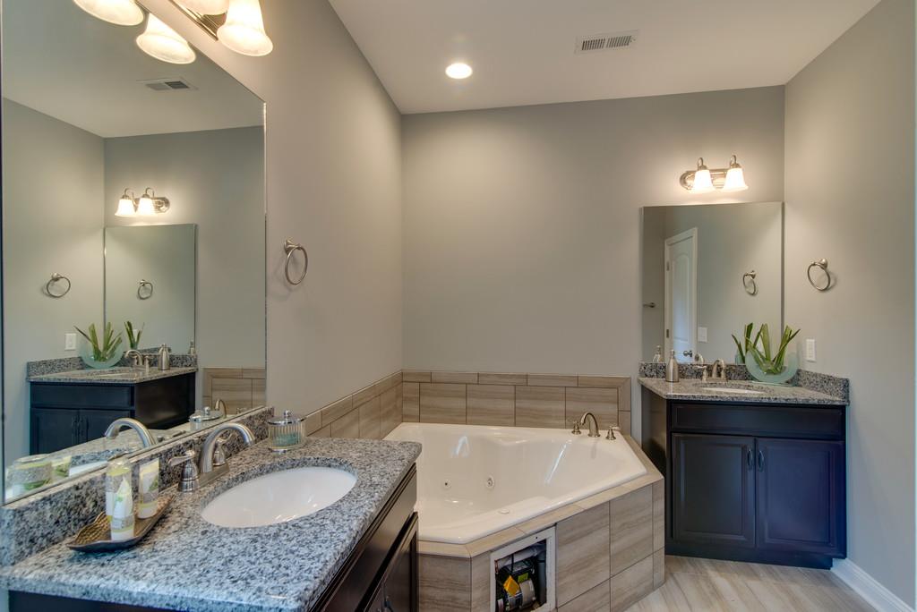 417 Kaiser Road Dickson, TN 37055 - Photo 12 of 30 a bathroom with a sink and a mirror